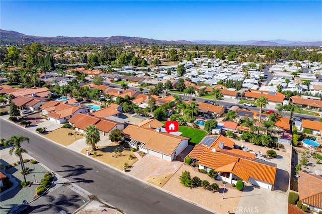 birds eye view of property featuring a residential view and a mountain view