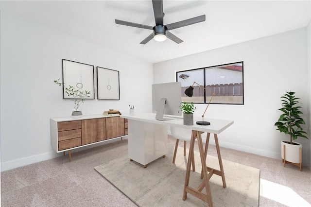 home office with light carpet, ceiling fan, and baseboards