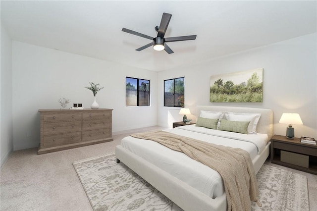 bedroom with light colored carpet and ceiling fan