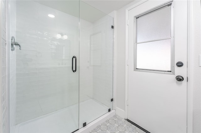 full bath featuring a shower stall