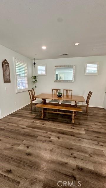 dining room with recessed lighting, dark wood finished floors, and baseboards