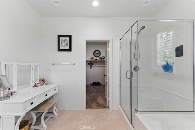 full bath with baseboards, recessed lighting, and a shower stall