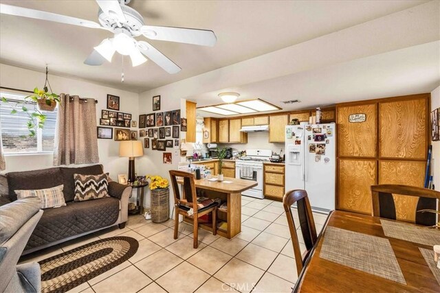 dining room featuring light tile patterned floors, ceiling fan, and visible vents