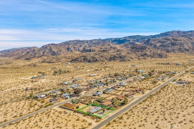 drone / aerial view with a desert view and a mountain view