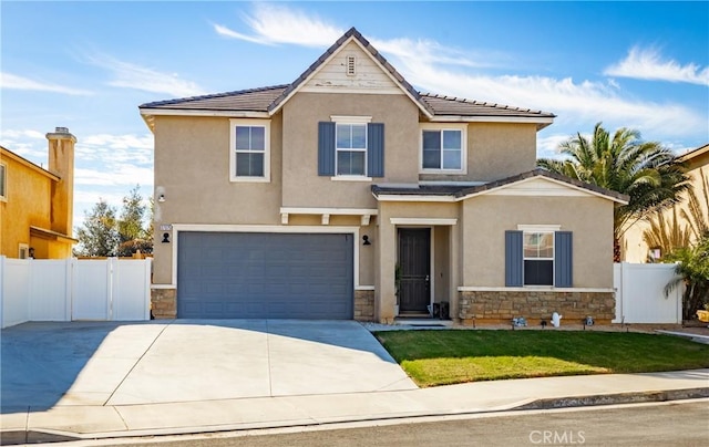 view of front of home with stone siding, fence, concrete driveway, and stucco siding