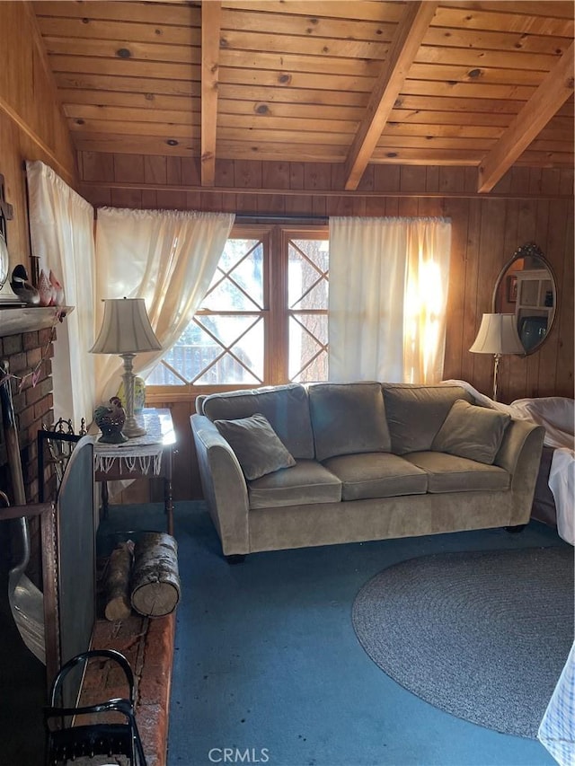 carpeted living area with wood walls, wood ceiling, a brick fireplace, and beamed ceiling