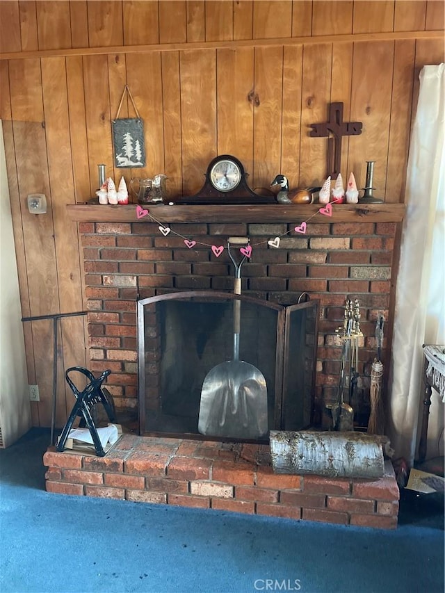 room details with a brick fireplace and wood walls