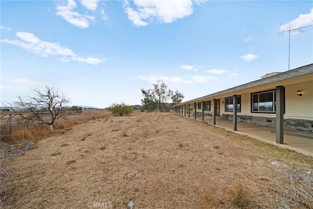 view of yard with a patio and fence