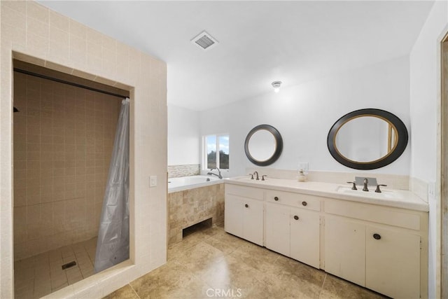 full bathroom with a garden tub, a sink, visible vents, and a shower stall