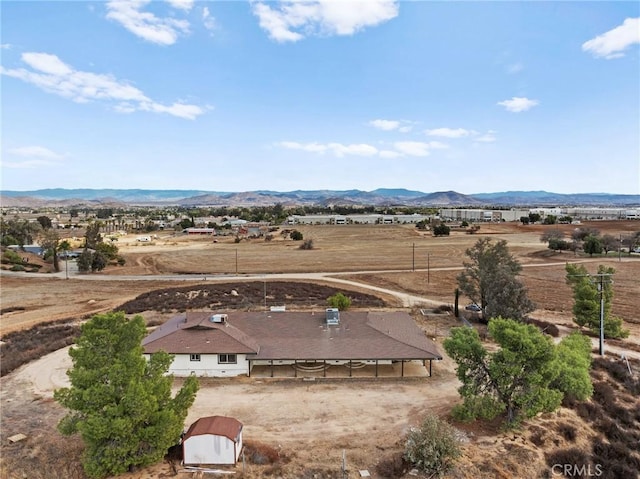 birds eye view of property featuring a rural view and a mountain view