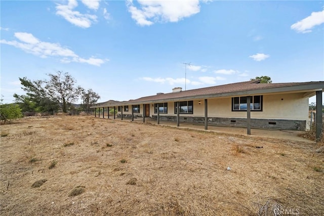 back of property featuring crawl space