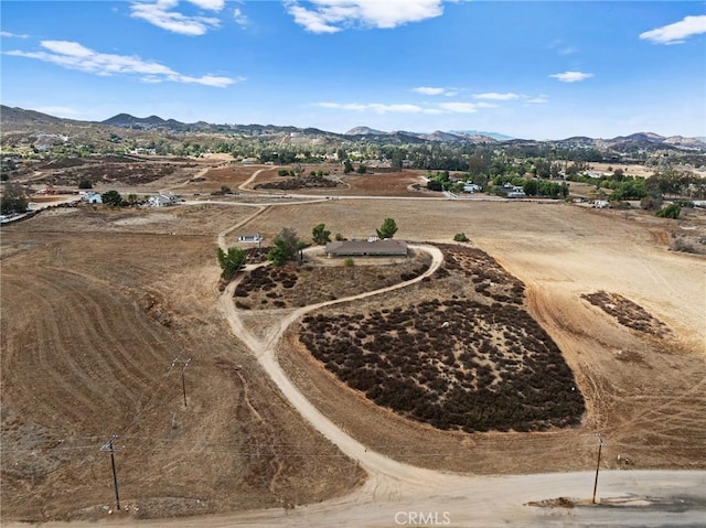 birds eye view of property with a mountain view