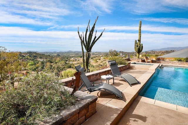 view of pool with an in ground hot tub, a patio, and a fenced in pool