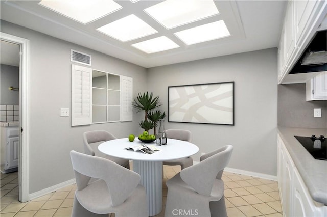 dining space with visible vents, baseboards, and light tile patterned floors