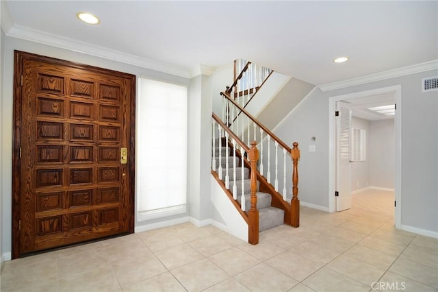 foyer featuring stairway, visible vents, baseboards, and light tile patterned floors