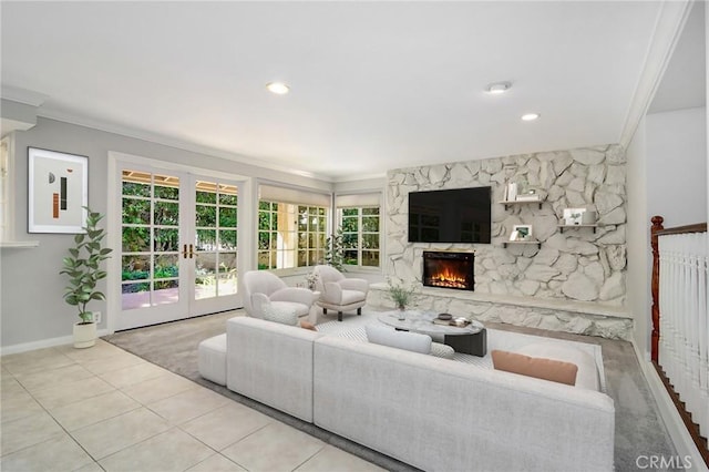living area featuring a high end fireplace, a wealth of natural light, french doors, and baseboards