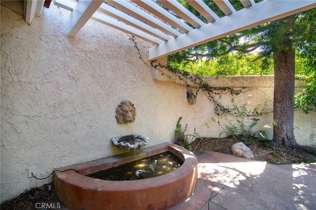 exterior space with fence and stucco siding
