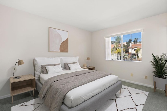 bedroom with carpet flooring and baseboards