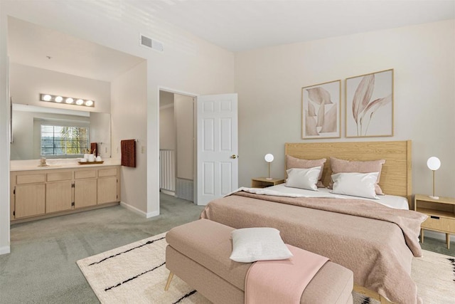 bedroom featuring baseboards, visible vents, and light colored carpet