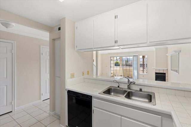 kitchen with black dishwasher, a sink, visible vents, and white cabinets