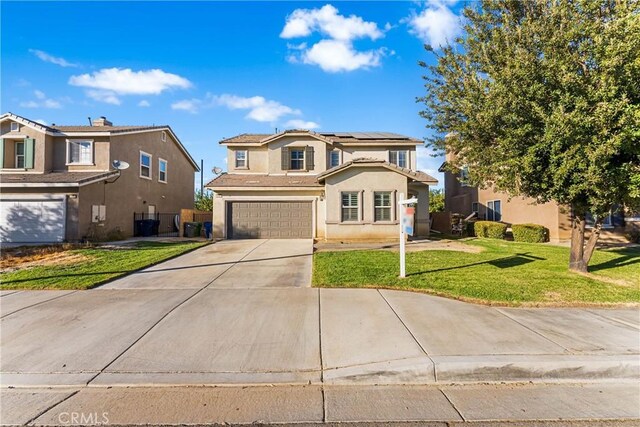 traditional-style house featuring a garage, driveway, a residential view, a front lawn, and stucco siding