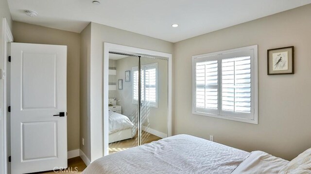 bedroom featuring a closet and baseboards