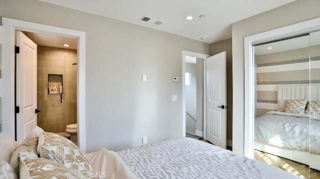 bedroom with visible vents, a closet, and recessed lighting