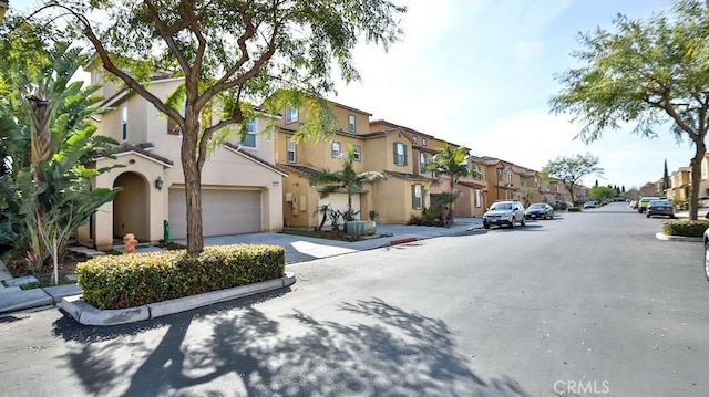 view of street featuring curbs, sidewalks, and a residential view