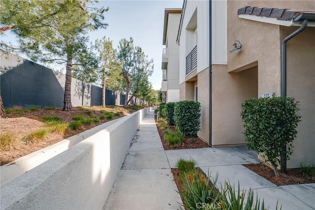 view of property's community featuring fence