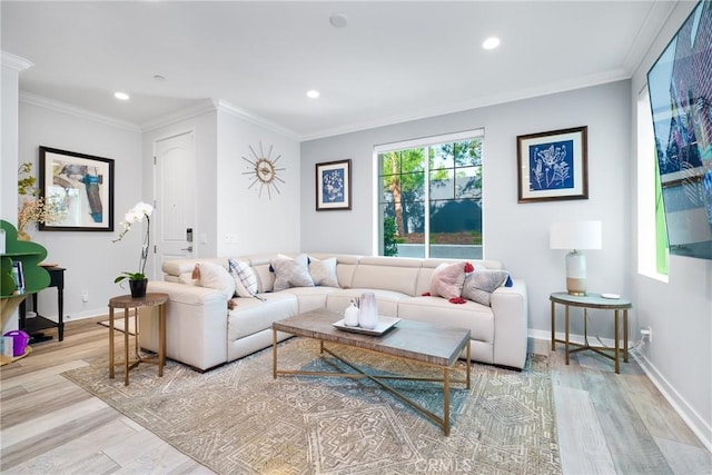 living area featuring light wood-type flooring, crown molding, baseboards, and recessed lighting