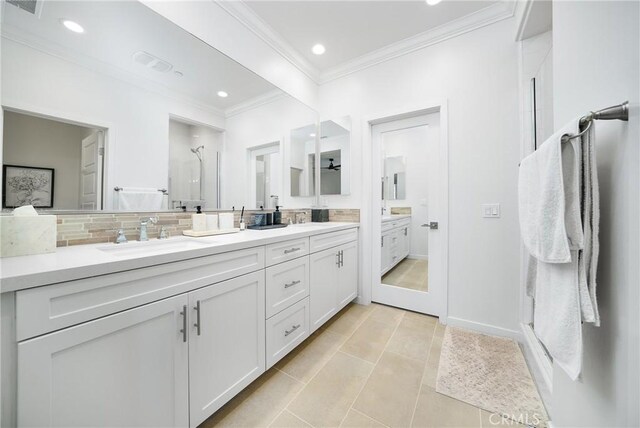 full bathroom with recessed lighting, a sink, backsplash, double vanity, and crown molding