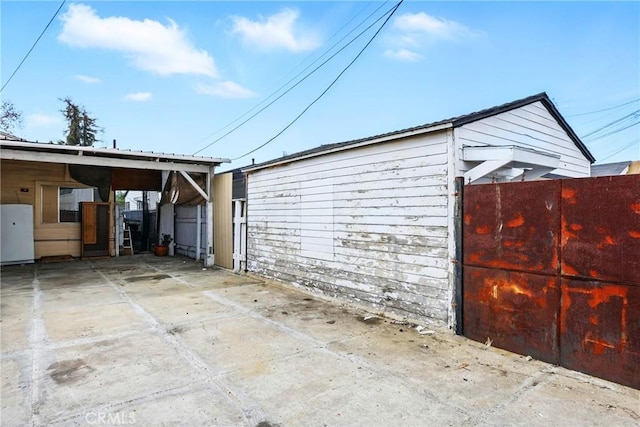 garage with fence