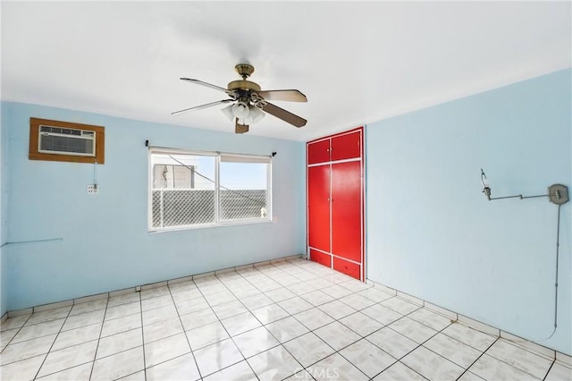 unfurnished room featuring a wall mounted AC and a ceiling fan