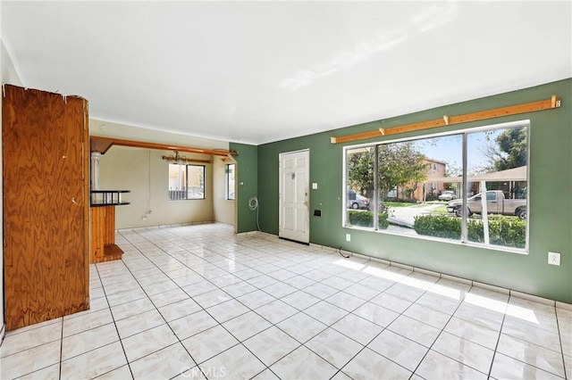 unfurnished living room with light tile patterned flooring