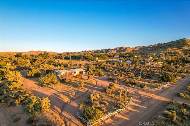 birds eye view of property featuring a mountain view