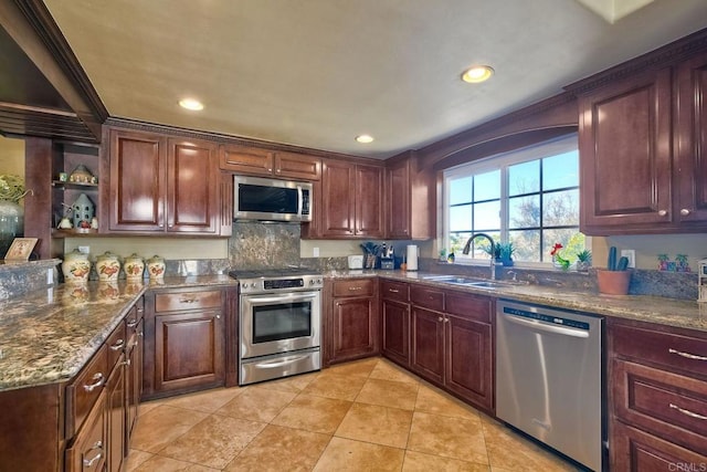 kitchen featuring a sink, dark stone counters, recessed lighting, stainless steel appliances, and open shelves