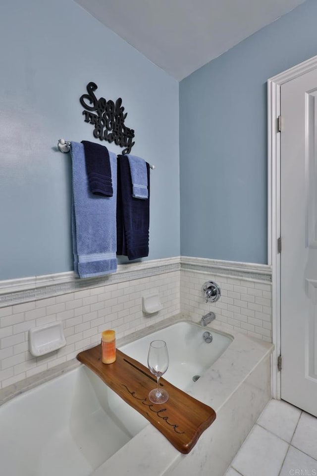 full bathroom with tile patterned flooring and a garden tub