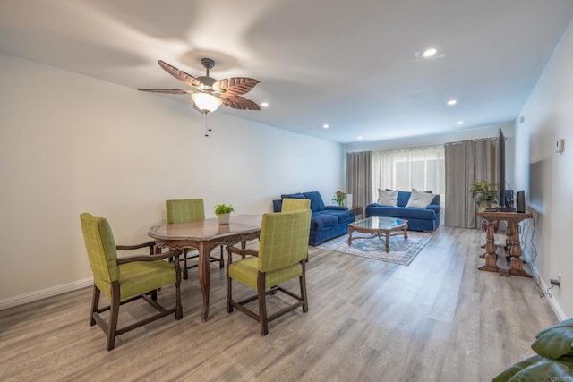 dining room featuring light wood-type flooring, ceiling fan, baseboards, and recessed lighting