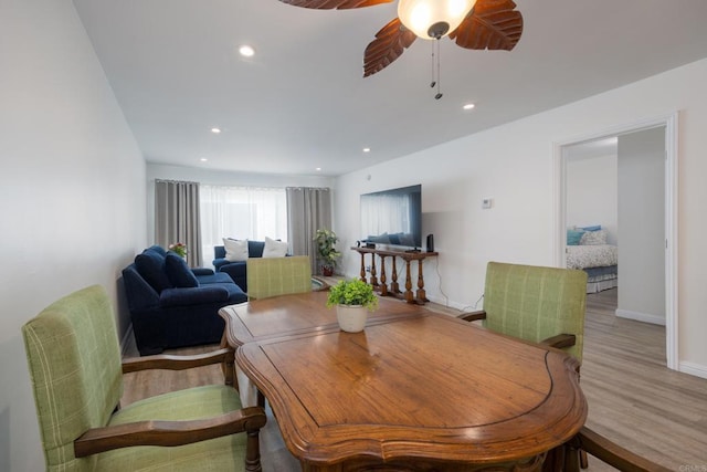 dining space with wood finished floors, baseboards, ceiling fan, and recessed lighting