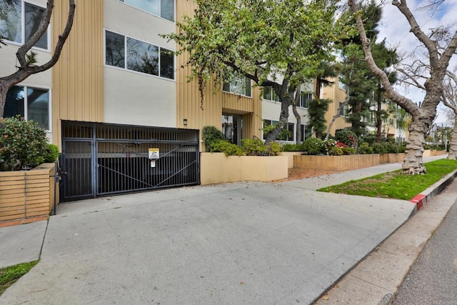 view of property with fence
