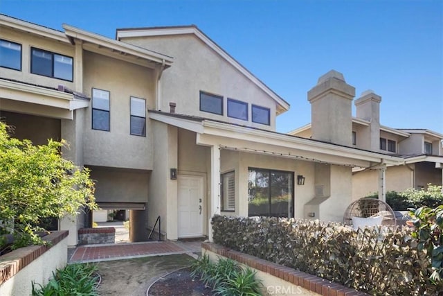 exterior space featuring stucco siding