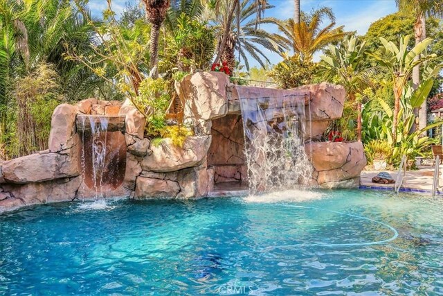 view of pool with a fenced in pool