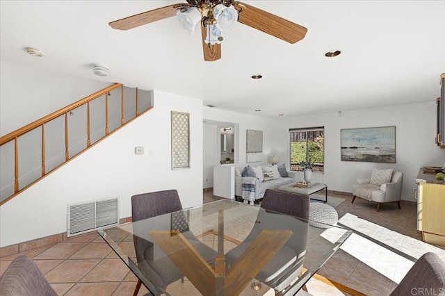 tiled dining area featuring stairs, recessed lighting, visible vents, and baseboards