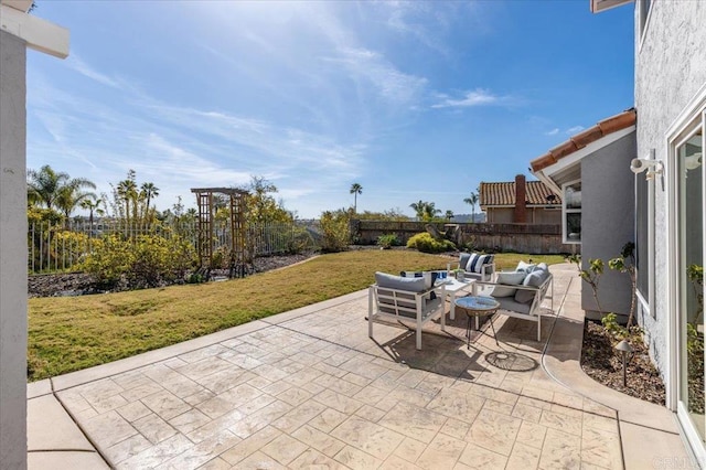 view of patio featuring outdoor lounge area and a fenced backyard