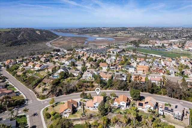 aerial view featuring a residential view and a water view