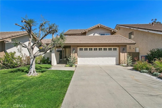 traditional home featuring a garage, a tile roof, concrete driveway, stucco siding, and a front yard