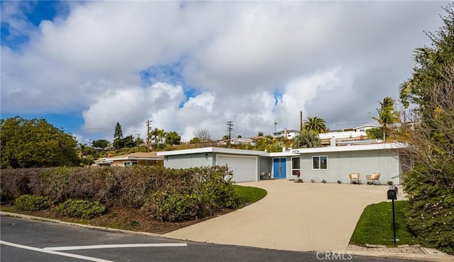 view of front of house featuring concrete driveway