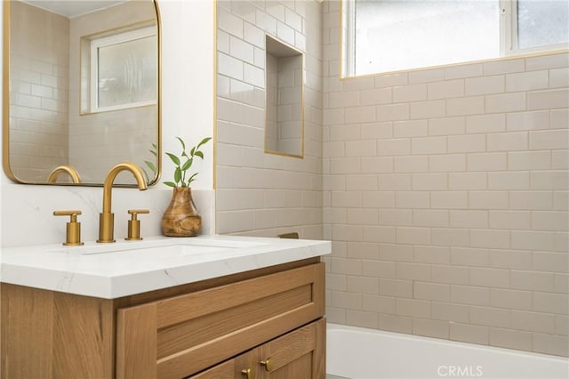 bathroom with shower / washtub combination and vanity