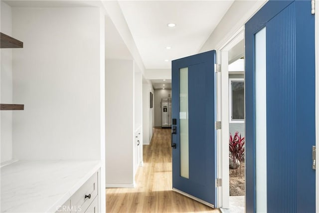 hall featuring recessed lighting and light wood-style flooring