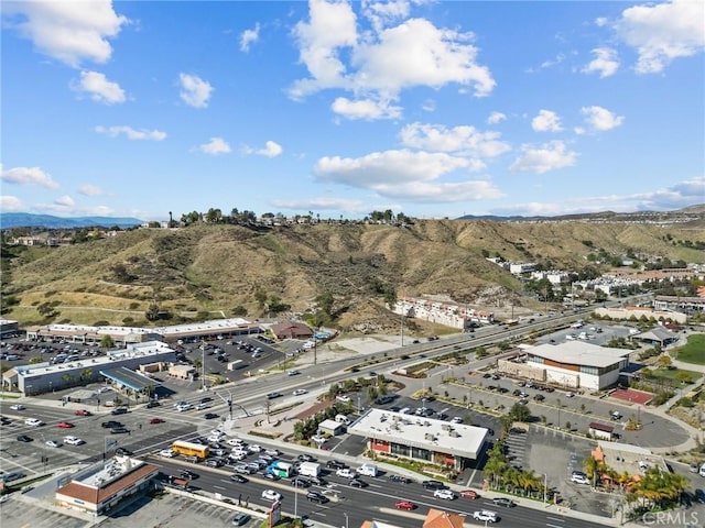 birds eye view of property featuring a mountain view